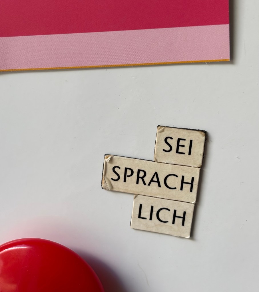 Fridge magnet words with German words 'Sei Sprachlich'